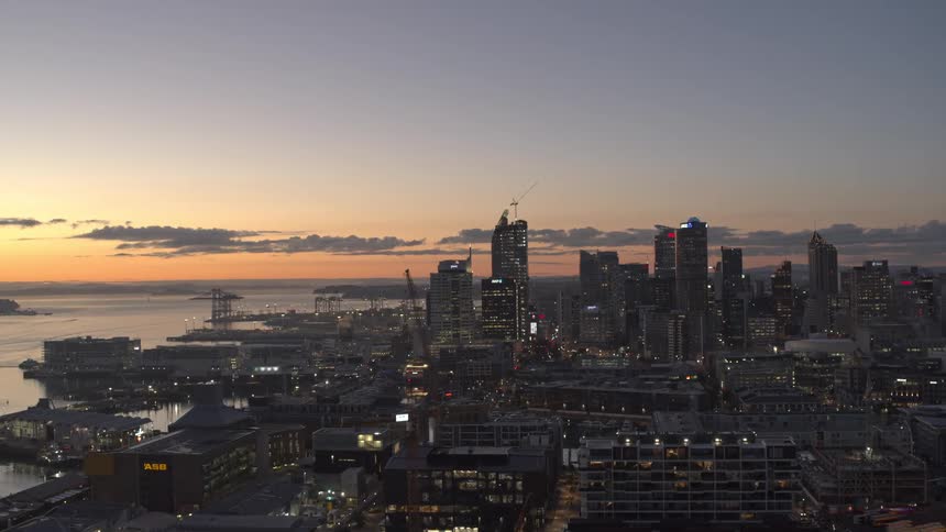 Tall buildings fill the city on the shore