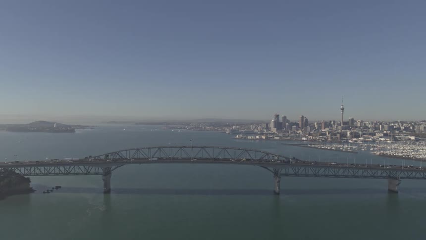 Fog covers the bridge as traffic travels over