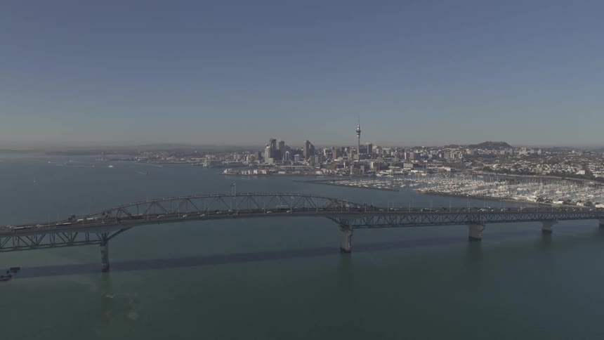 Heavy traffic is on the bridge leading to the city