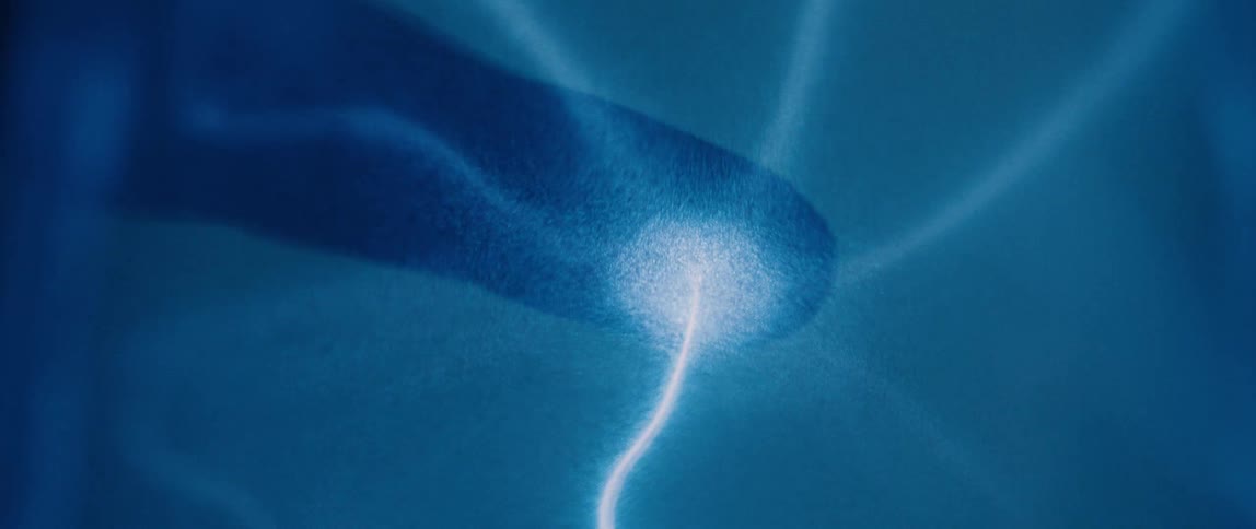 Close up and abstract on a finger with blue magnetic waves