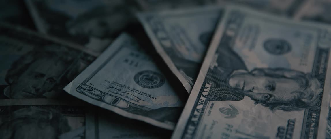 Close up of several dollar bills