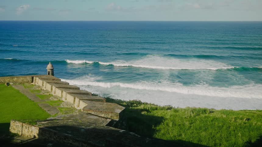 The small waves are hitting the shore