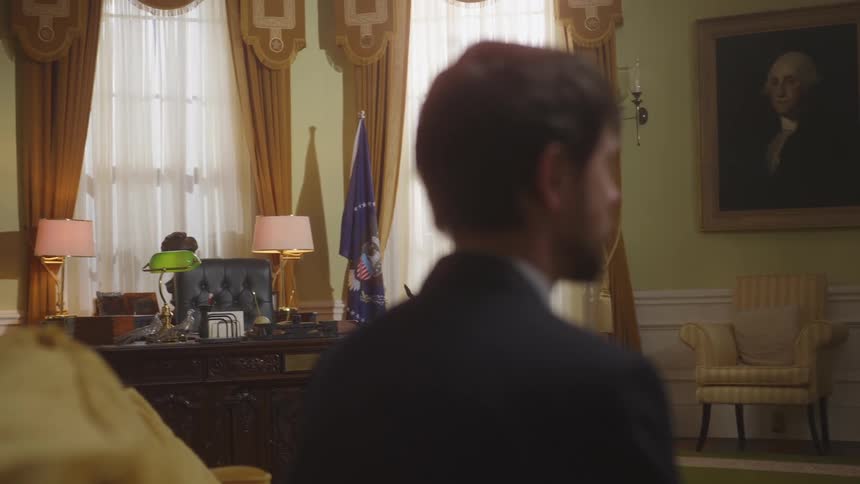 A man is sitting in the oval office and talking
