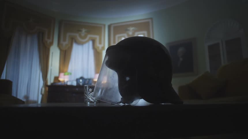 Protective helmet on top of a wooden table in the living room