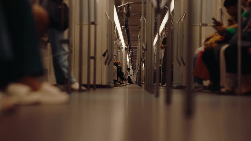 The train is full of seating people traveling