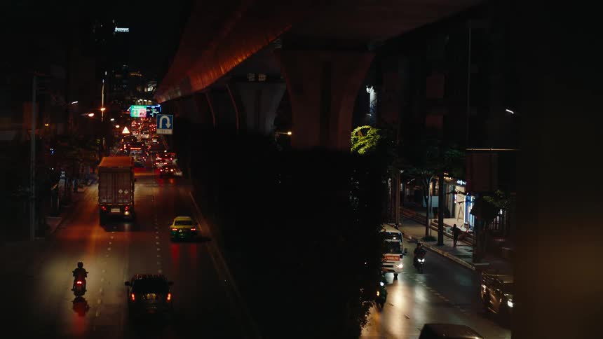 Traffic is flowing through the city at night