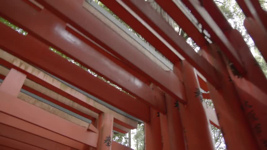 Walking under orange wooden slats
