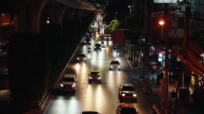 City street at night with vehicle traffic