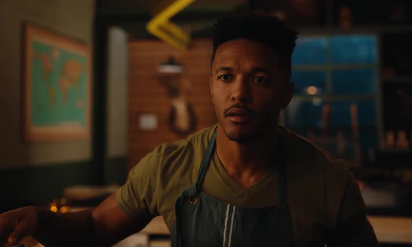 Man in apron working in a coffee shop and getting a scared facial expression and leaving the place