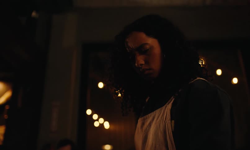 A woman looks worried in the restaurant