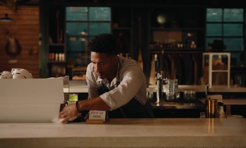 A footage of a man cleaning a front desk
