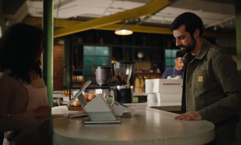 A man orders and pays in the restaurant