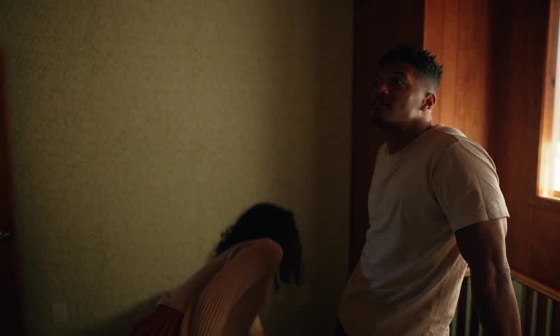 A mother drops a toy in the crib