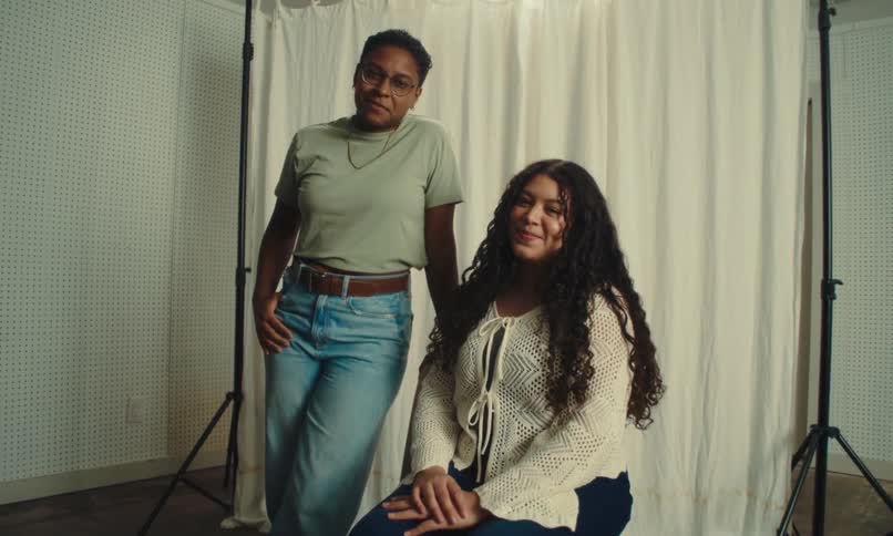 A video clip of two ladies posing in the studio