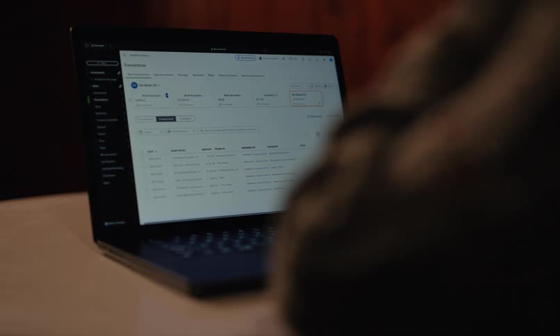 A woman is typing on her keyboard