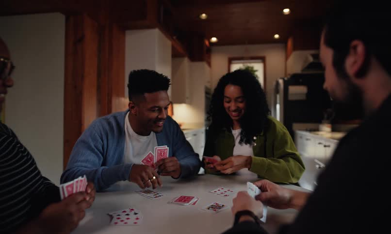 A footage of friends playing card game