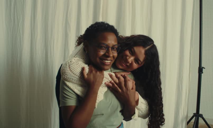 Two women in a loving moment hugging each other