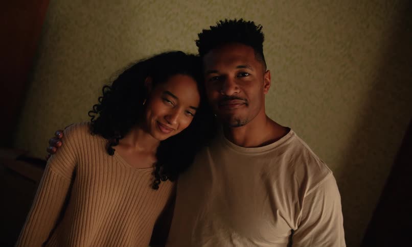Couple leaning their heads against each other in a romantic and happy way
