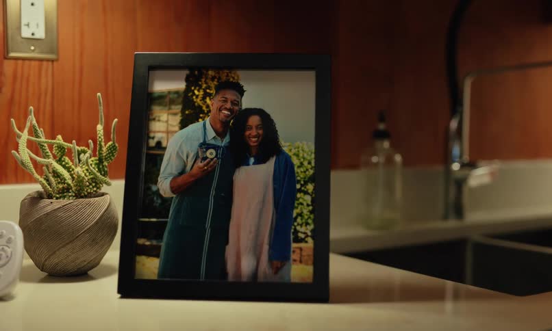 A framed picture shows a man and woman smiling
