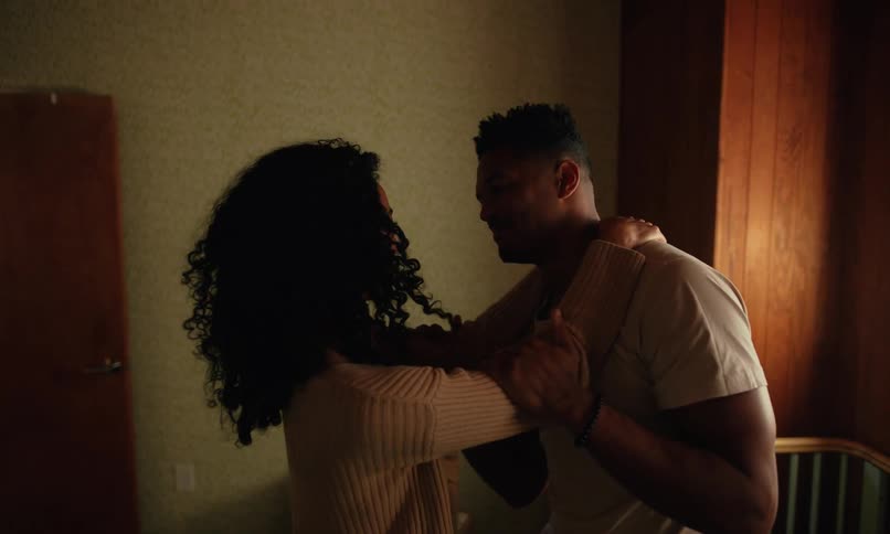 Husband and wife are dancing together in their home