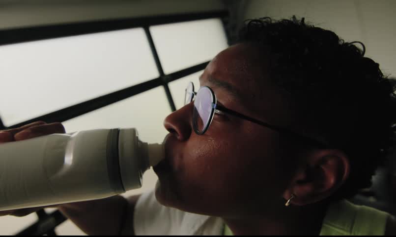 A footage of a person drinking water
