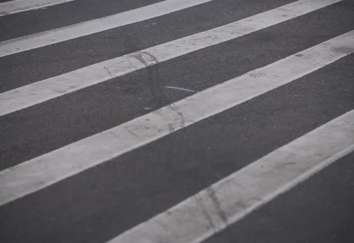 A footage of a person and a bike on the road