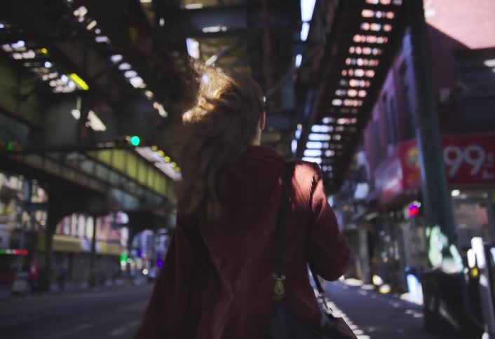 A footage of a lady walking the street