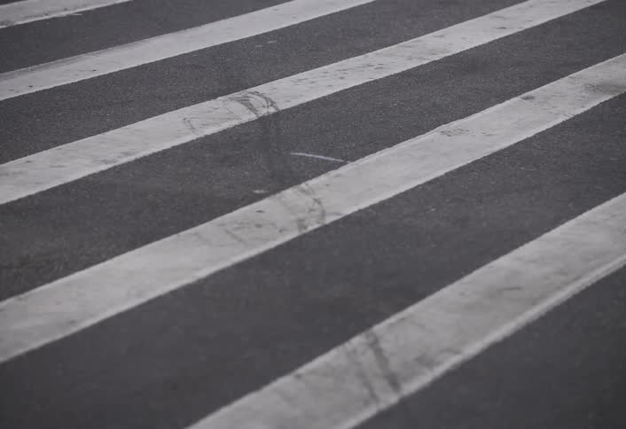 People are walking on the crosswalk