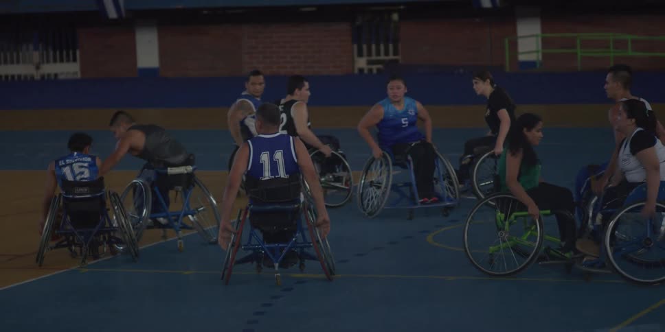Group of wheelchair users playing basketball
