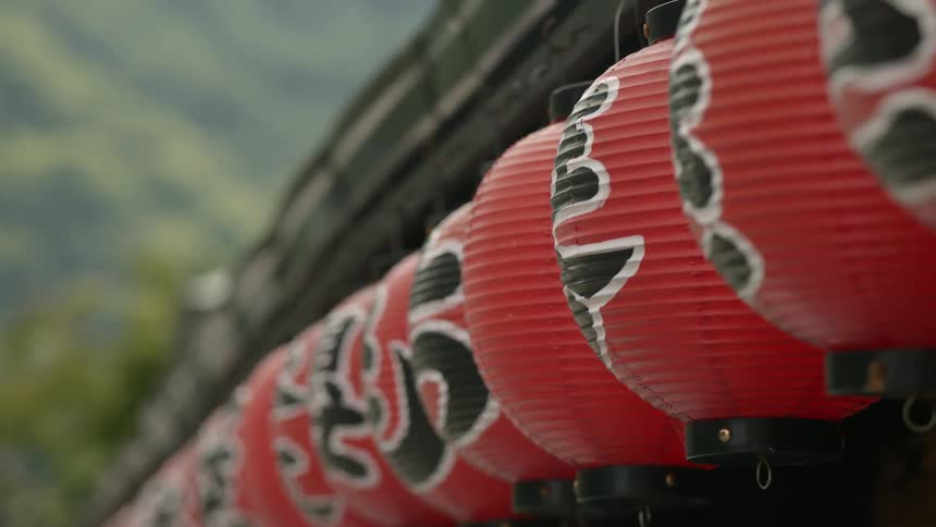 Red lanterns hang blowing in the wind