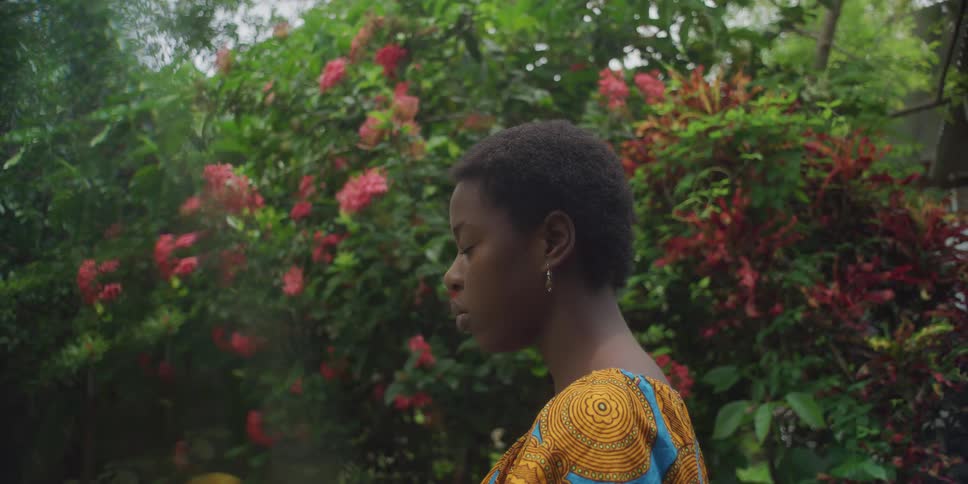 A woman sighs as she gazes at nature