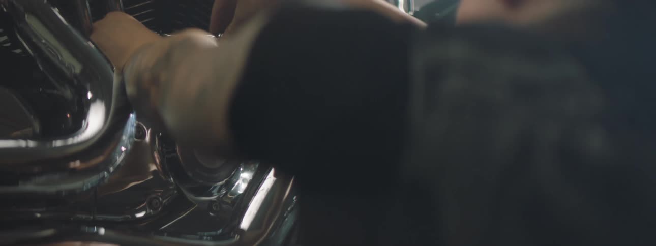 Mechanic working on a motorcycle engine