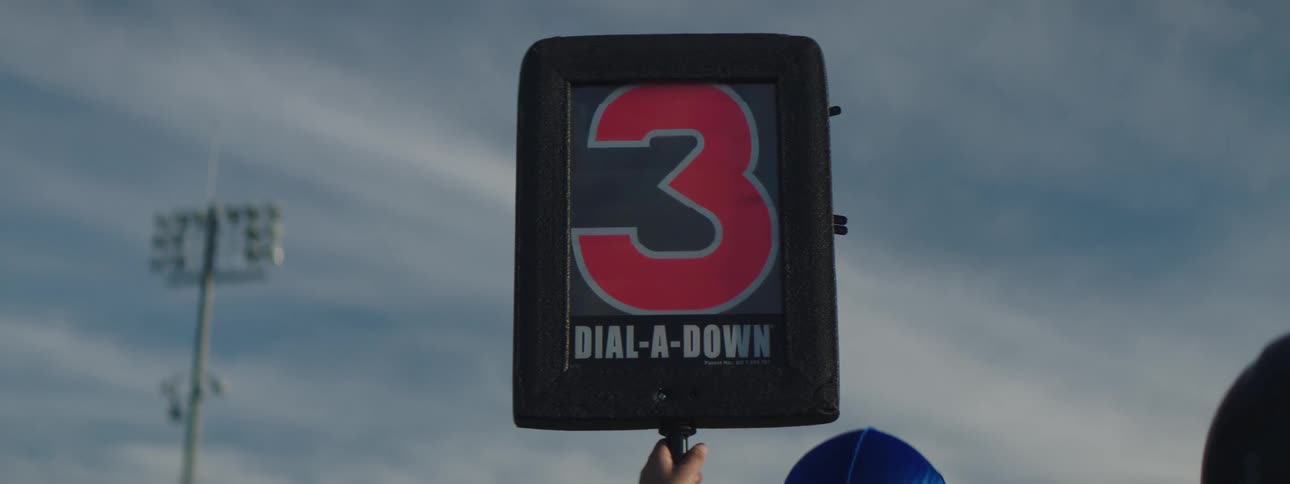 A man changes the number on his sign