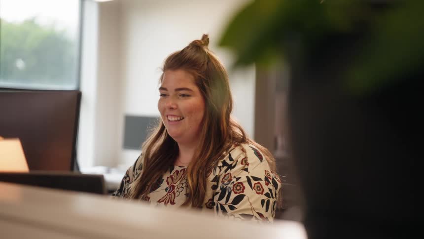 Smiling woman in an office environment