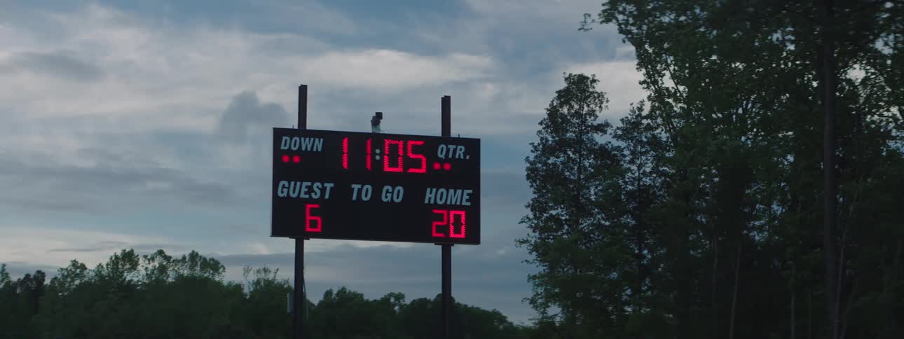 A football scoreboard displays a score