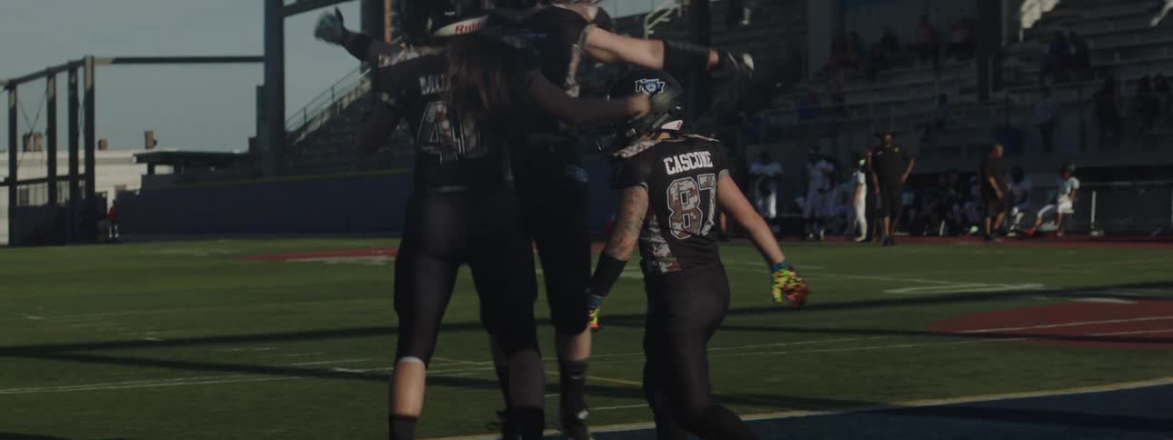 Womens american football team celebrating
