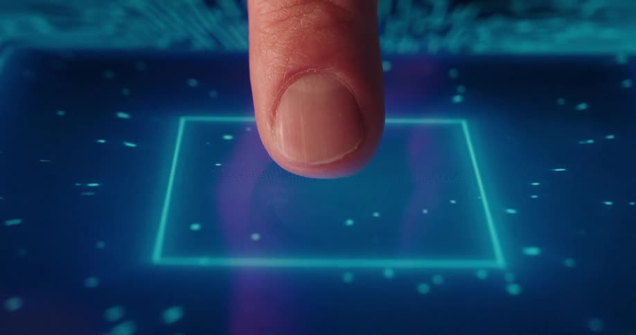 A finger presses a blue square