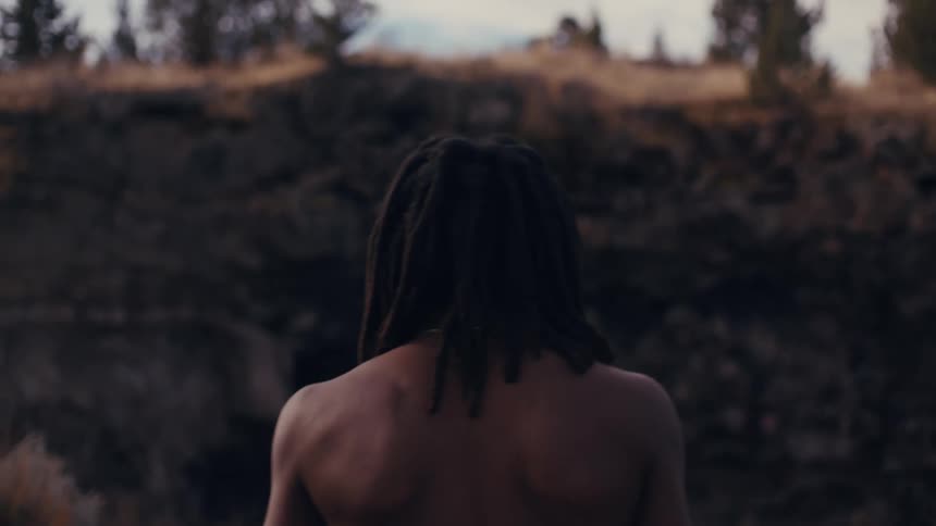 A man runs towards the mountain