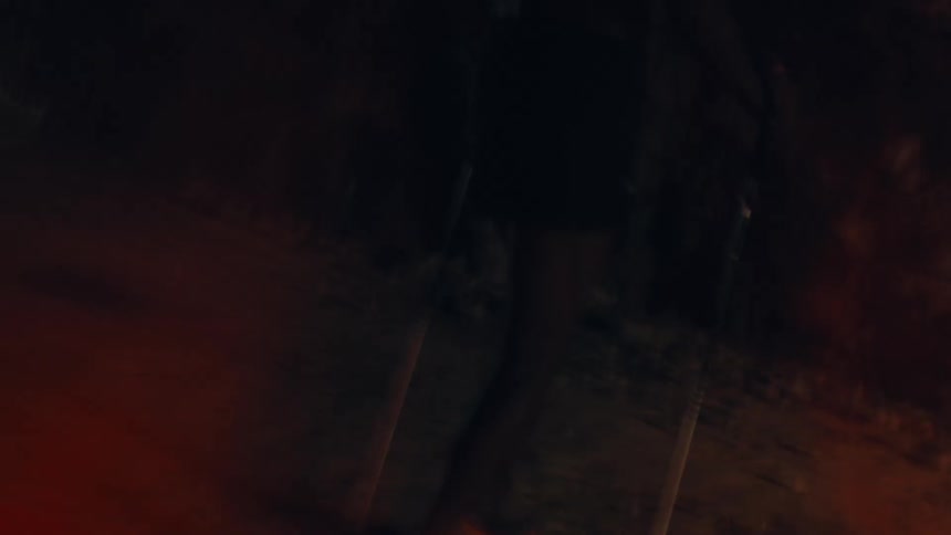 A person running away from someone in the midst of nature