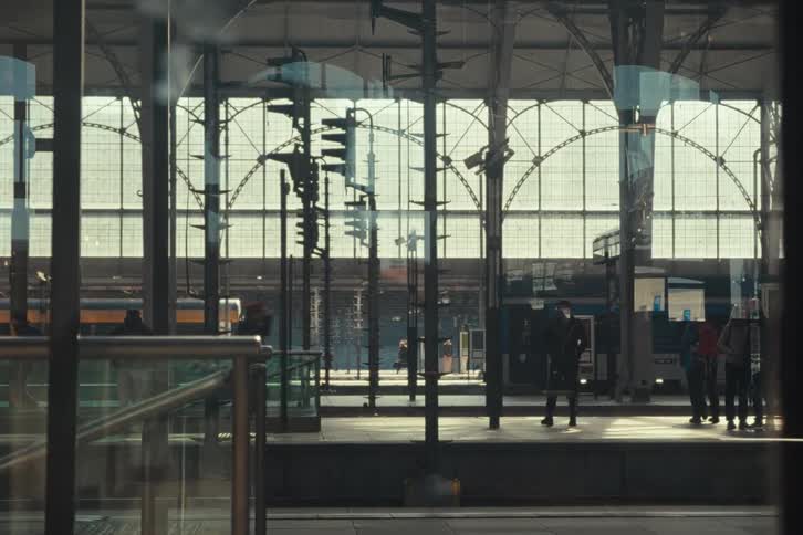 A man is running on the train platform