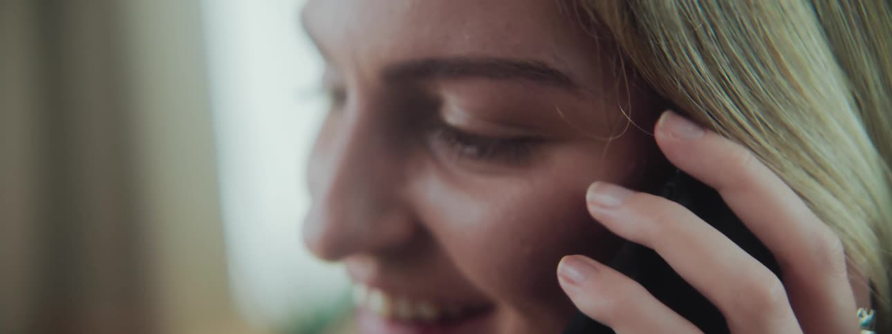 Portrait of a woman talking on a call on the phone