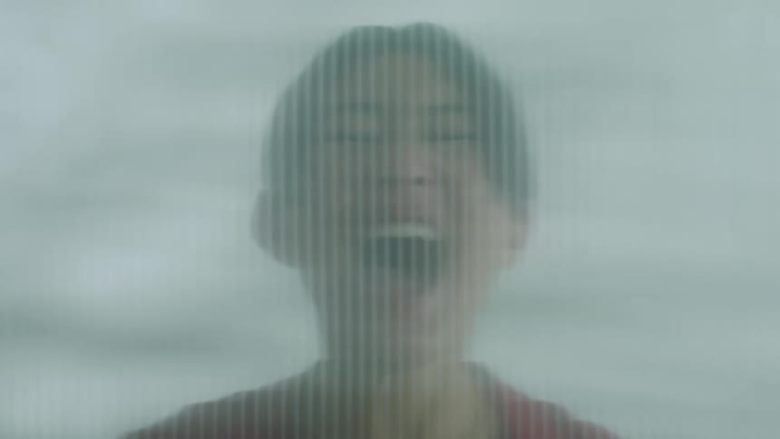 An asian woman screaming with all her strength