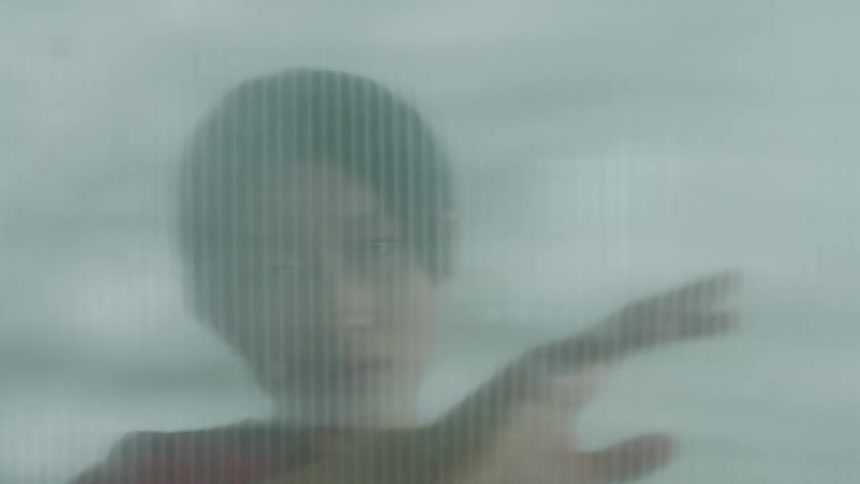 An asian woman dancing and moving her hands seductively