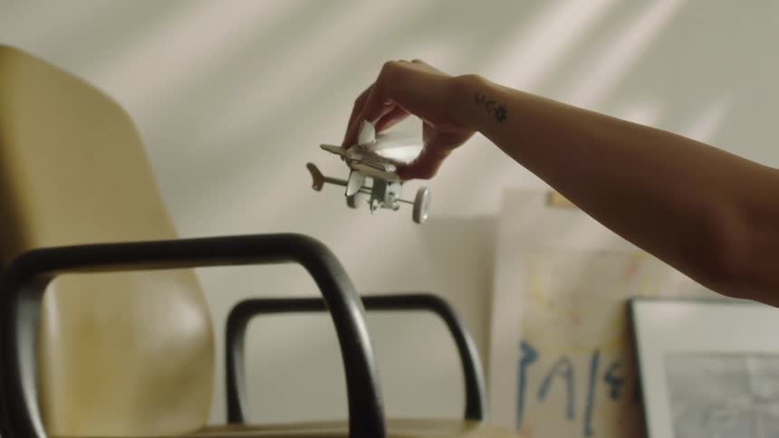 A footage of a person playing with a toy plane