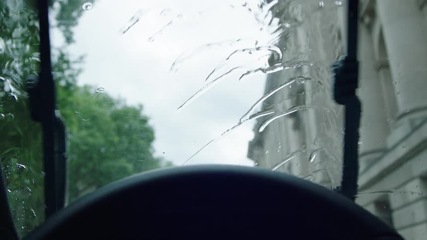 Rain pours on the windshield