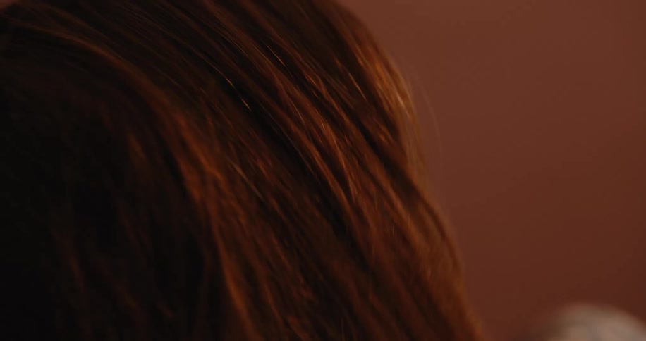 Close up of a womans red hair