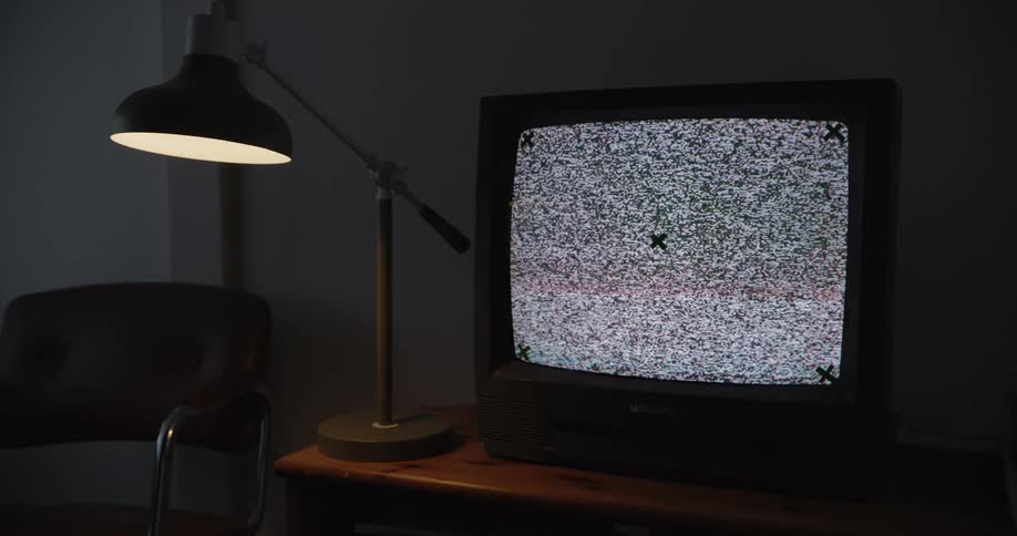 The static is flashing on the small television screen