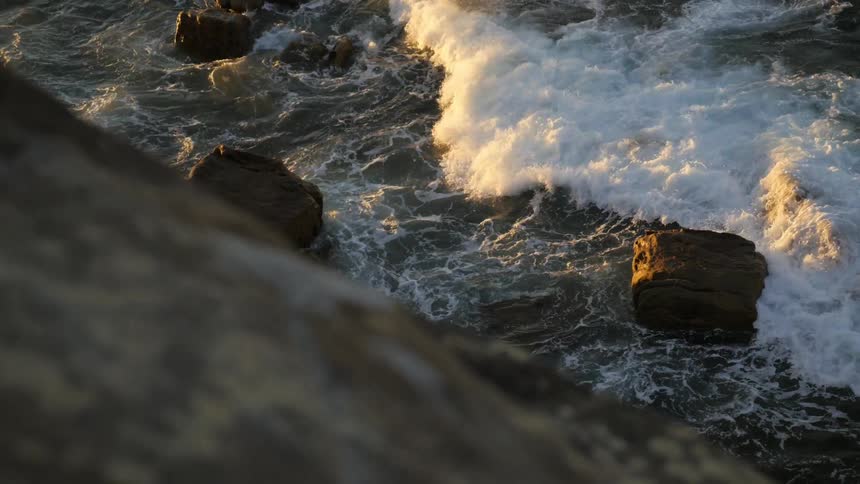 Waves crash on a rocky coast