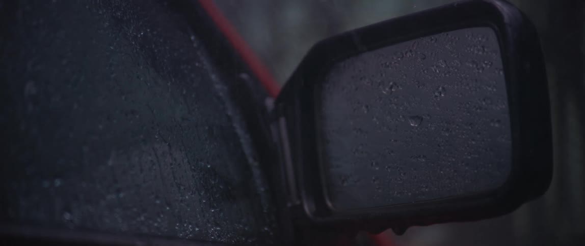 Rain is pouring down on the vehicle in motion