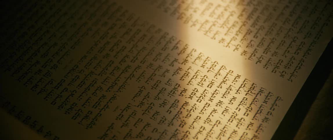 A person rolls out the page filled with words